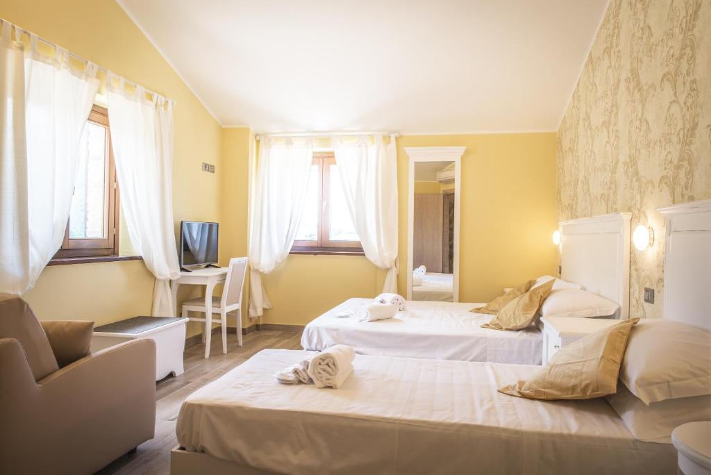 Postel nebo postele na pokoji v ubytování La Dimora di Francesco