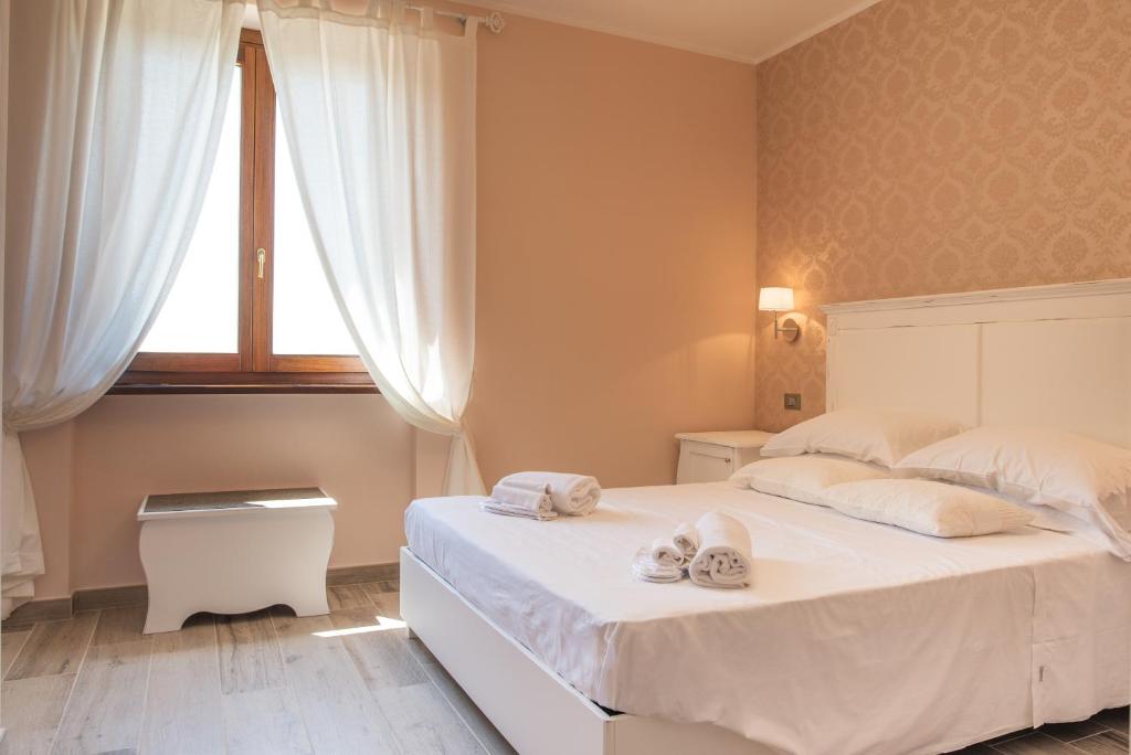 Postel nebo postele na pokoji v ubytování La Dimora di Francesco