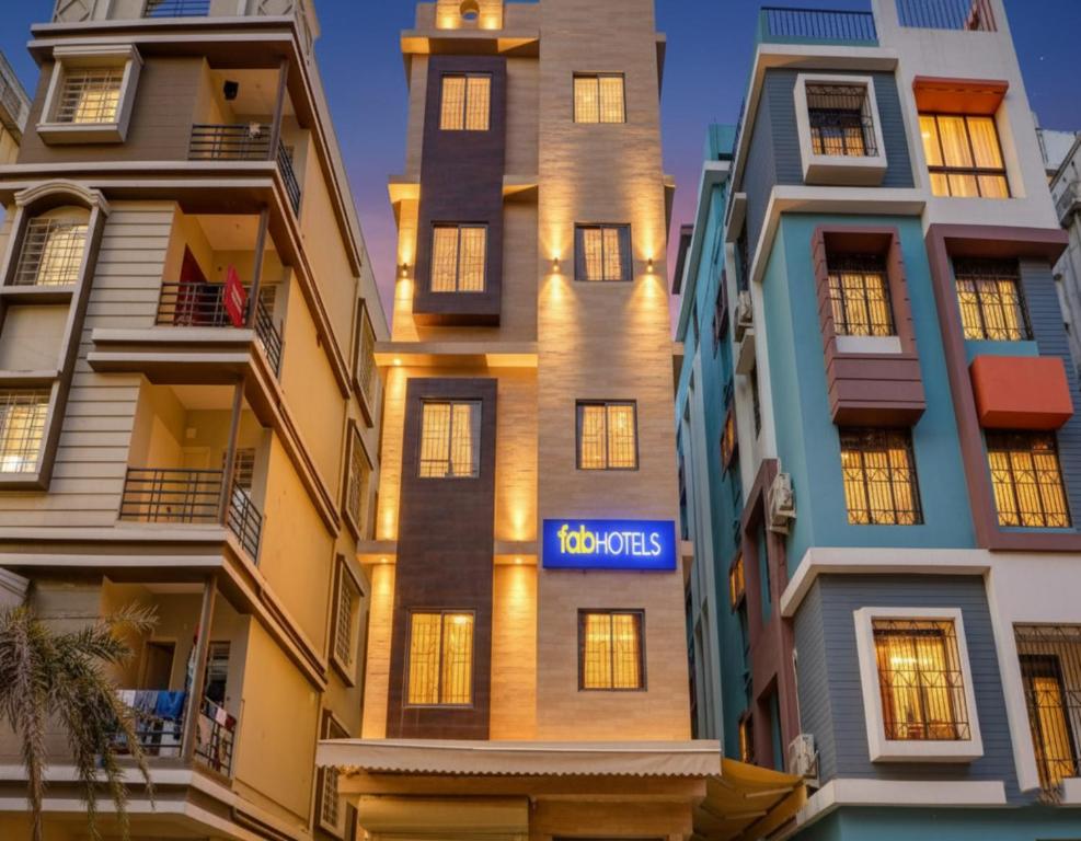 a building with a sign that says topos at FabHotel Carnival in Kolkata