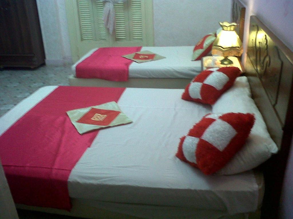 Postel nebo postele na pokoji v ubytování Cairo Moon Hostel