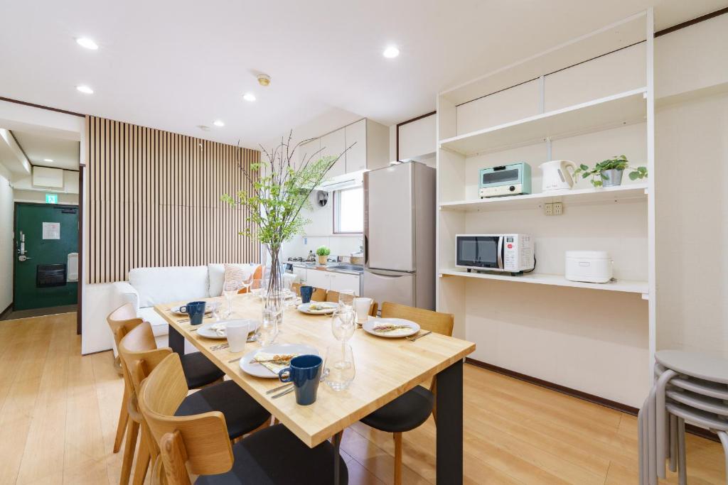 a kitchen and dining room with a table and chairs at Nagoya 12min Legoland 25min 3BR 4Beds Sofa 9ppl in Nagoya