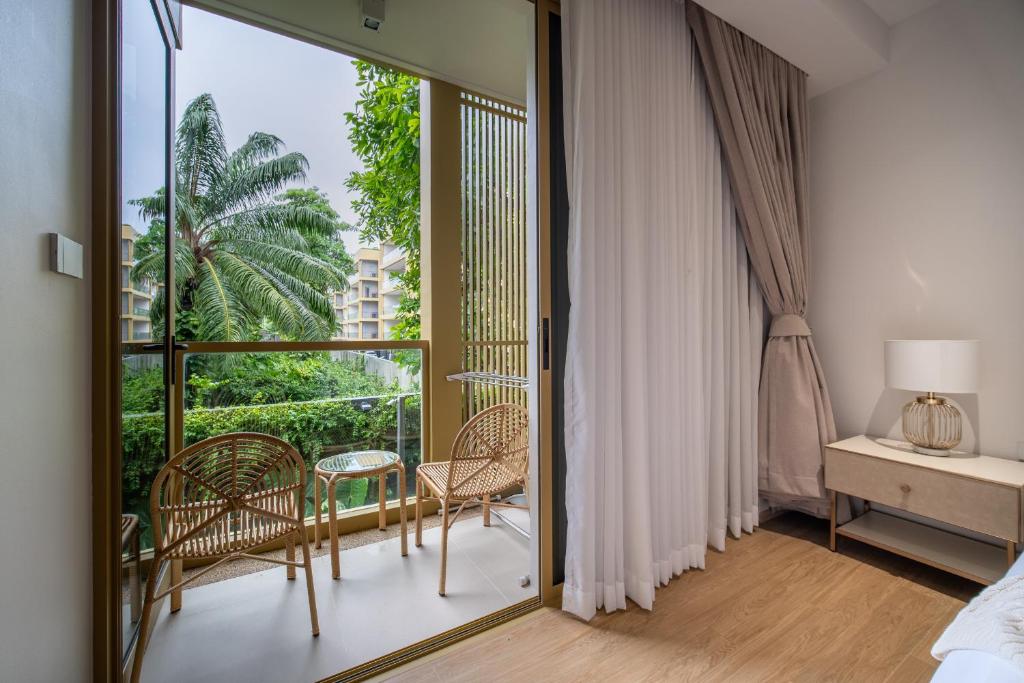 Ένα ή περισσότερα κρεβάτια σε δωμάτιο στο Beachside 1 BR apartment by NLA