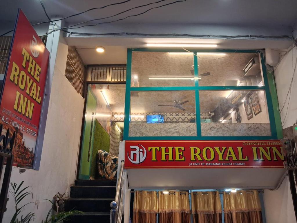 a building with a sign that reads the royal inn at The Royal Inn in Jāmb