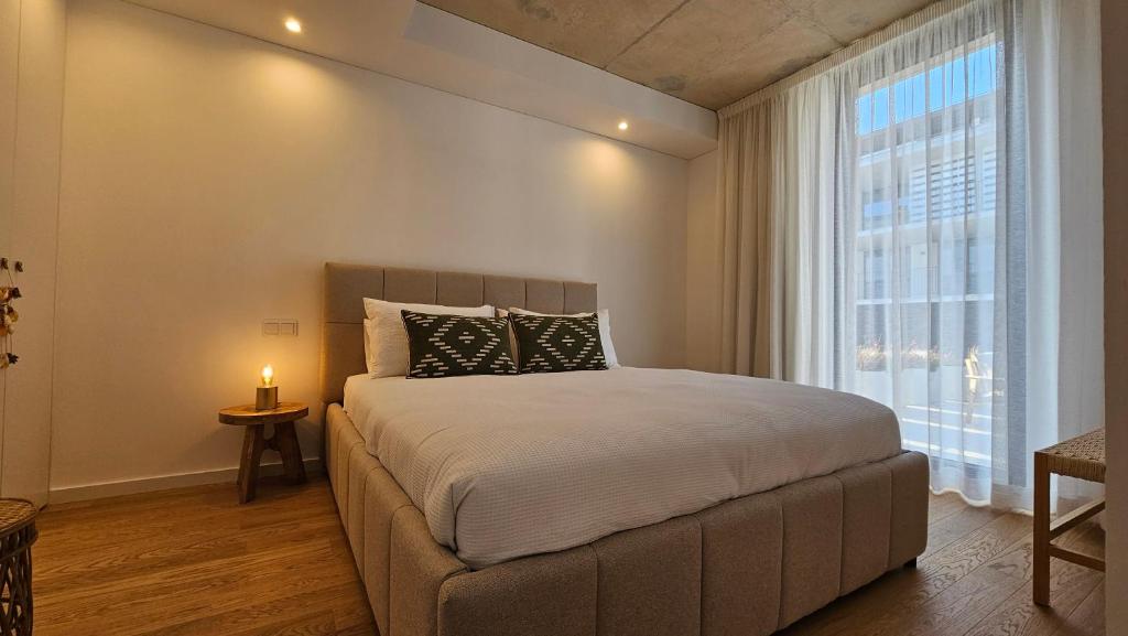 En eller flere senge i et værelse på A Proa do Moliceiro DOCA Terrace Barra Beach