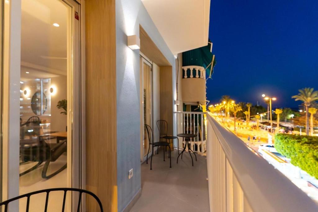 a balcony with a view of a street at night at Braceli Beach Resort Middle Floor - rentafive in Santa Pola