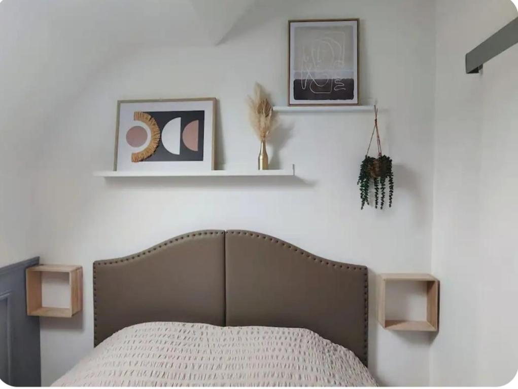 En eller flere senge i et værelse på Appartement centre ville Amiens