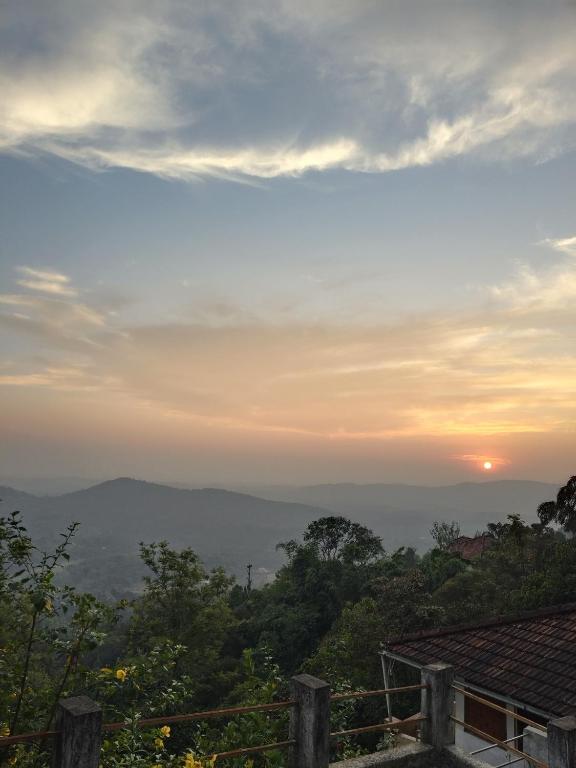 a view of the sunset from a house at Zawa Home stay,coorg in Madikeri