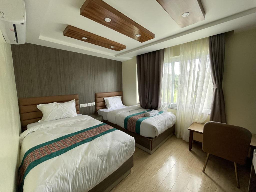 Ένα ή περισσότερα κρεβάτια σε δωμάτιο στο President Hotel Airport