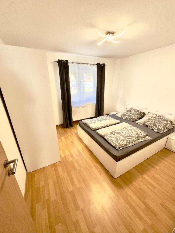 a bedroom with a bed and a ceiling fan at Medias Apartament in Mediaş