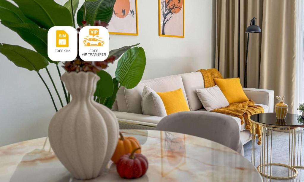 a living room with a vase on a table at Qoople Legend B - premium apartments steps from the sea in Alanya