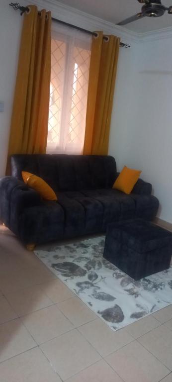 Khu vực ghế ngồi tại Mafric homes 1bedroom apartments