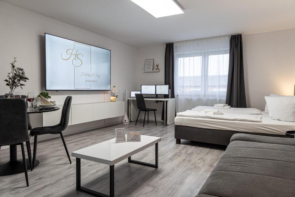 Postel nebo postele na pokoji v ubytování Holiday&Stay, Apartment Stay, Küche, 85Zoll TV, WLAN