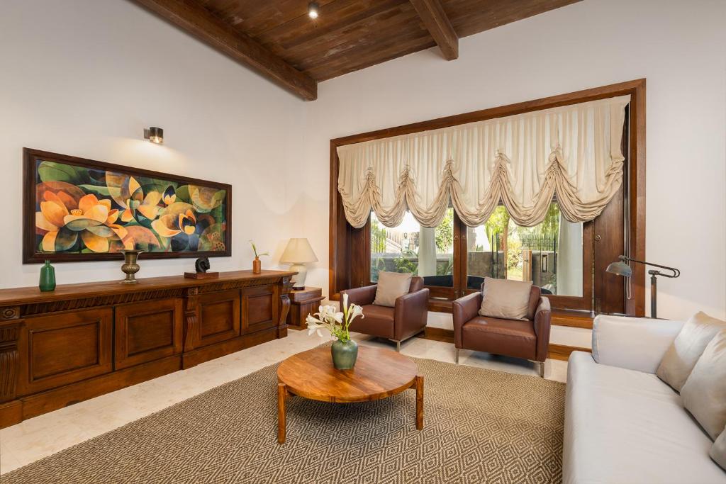 a living room with a couch and a table at La Muraille, Galle Fort in Galle