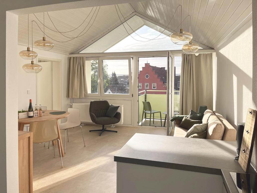 a living room with a couch and a table at nava-suites - 2-Zi-Appartement mit Naheblick mitten in Bad Kreuznach in Bad Kreuznach