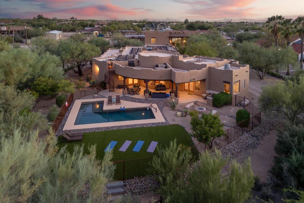 an aerial view of a house with a swimming pool at Mountain Views - Pool - Games - YogaDeck in Carefree