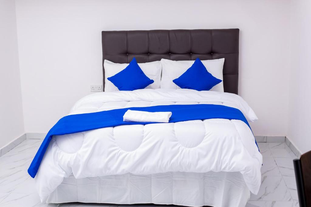 En eller flere senge i et værelse på Salama Blue Lodge