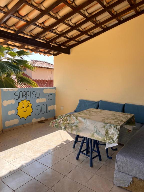 a table and chairs sitting on a patio at Sorriso Do Sol Suites in Arraial do Cabo
