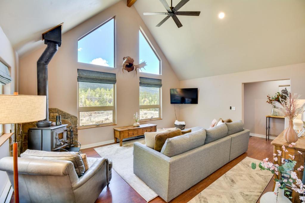 a living room with a couch and a fireplace at Hot Tub and Deck Cabin Near Dtwn Alma and Breck in Alma