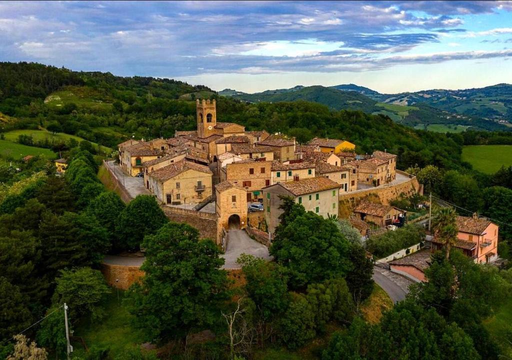 an aerial view of a village in the hills at La Loggia dei Fabbri - Montefabbri in Monte Fabbri