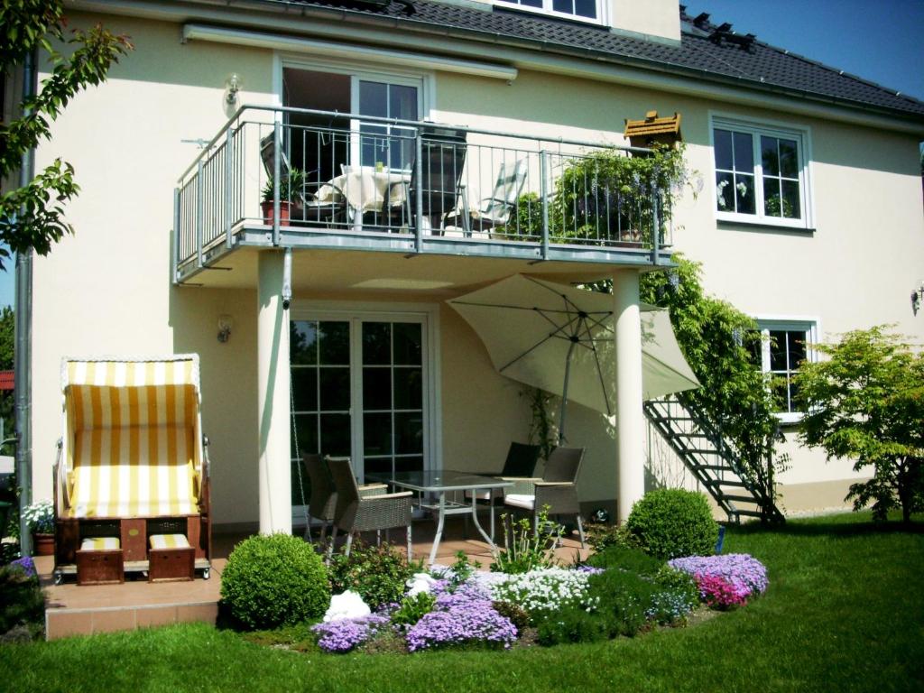 a dog sitting on the balcony of a house at Villa Bühlau in Dresden