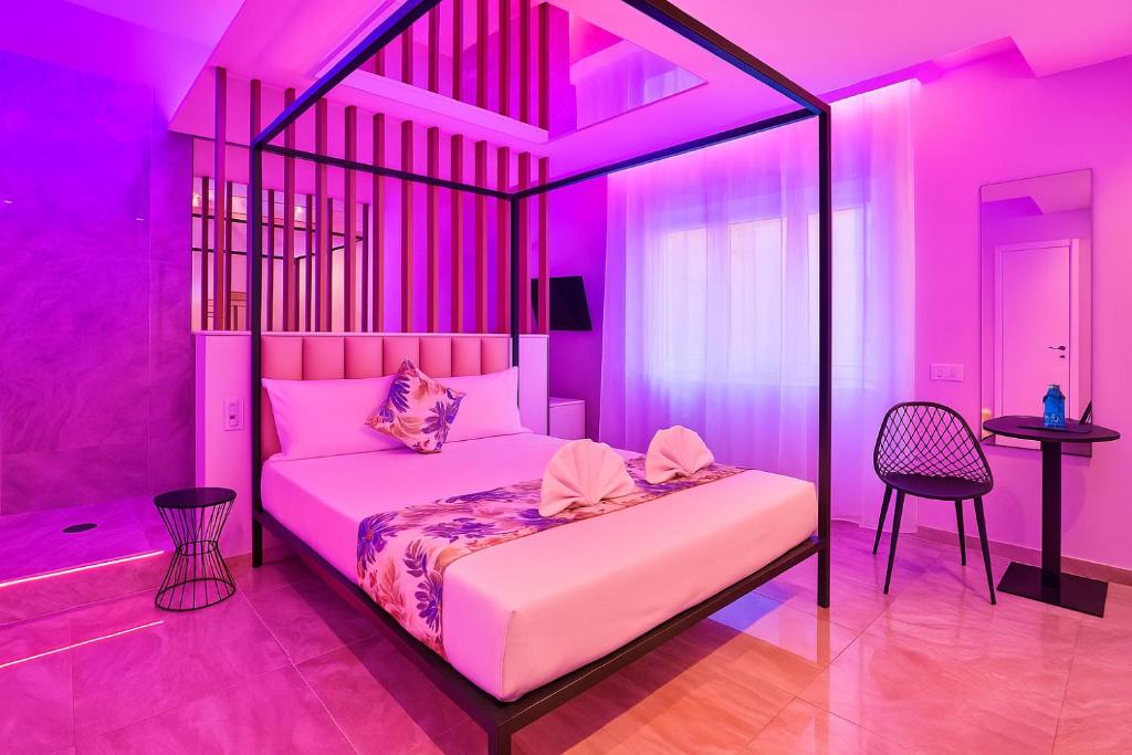 a bedroom with a bed with pink lighting at Bed Cinecittadue in Rome
