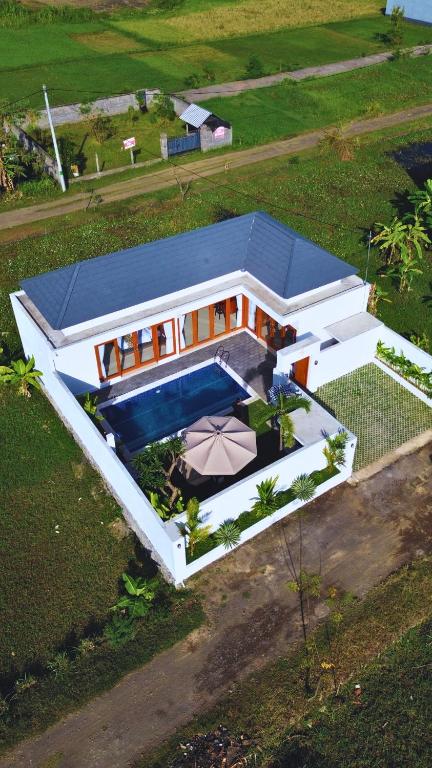 an overhead view of a house with a roof at Wisesa Lovina Villa in Lovina