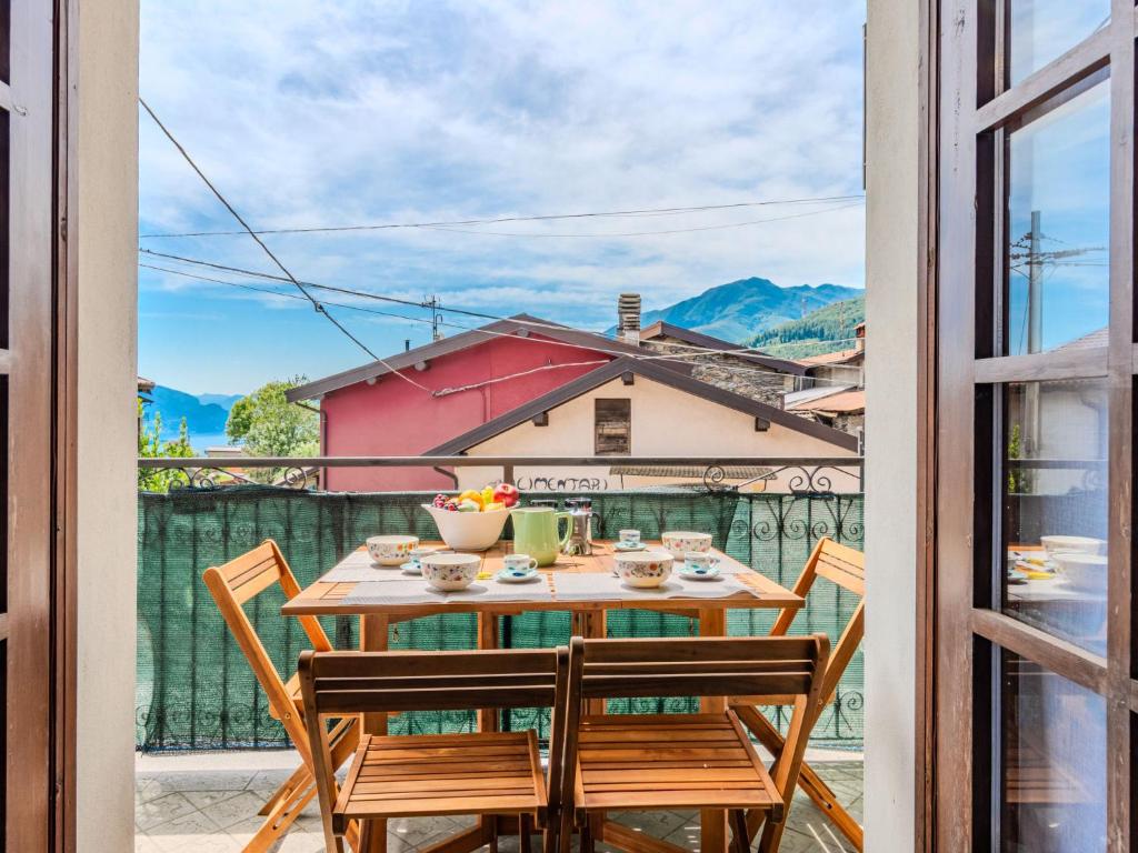 a table and chairs on a balcony with a view at Apartment Beppe by Interhome in Peglio