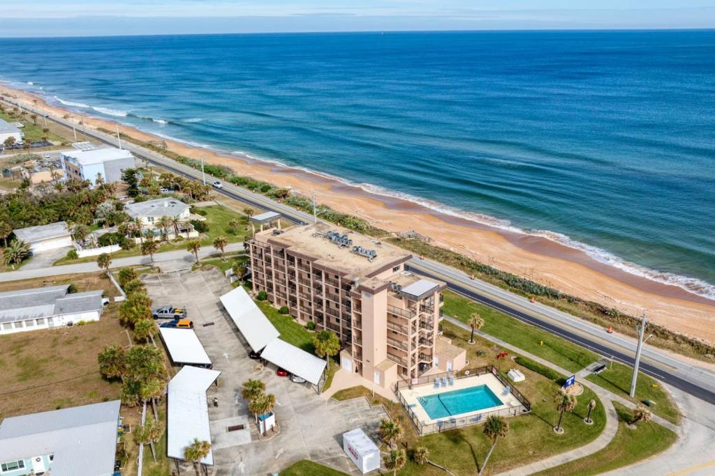 an aerial view of the hotel and the beach at Beach Dont My Vibe in Ormond Beach