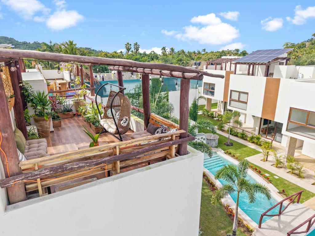 an aerial view of the balcony of a house with a swimming pool at Tranquil Jungle Retreat w Pool Bikes and Walk to Town in San Francisco