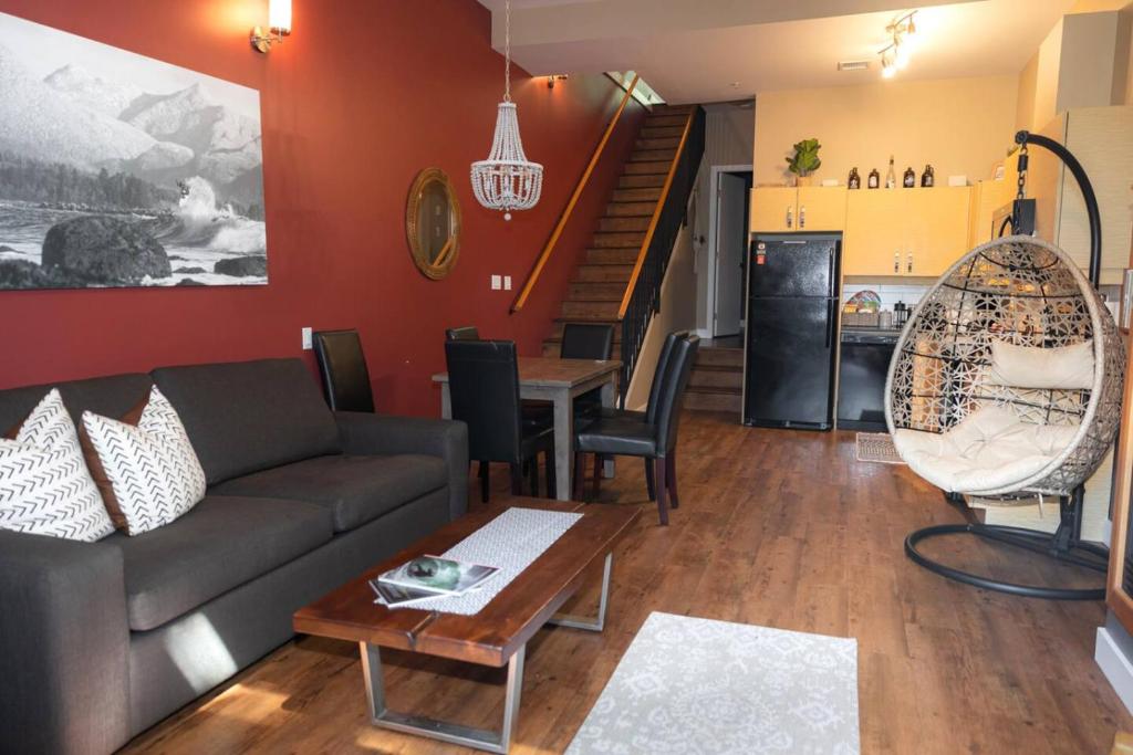 a living room with a couch and a table at The Inlet Haven - 2 Bedroom on the Inlet in Ucluelet