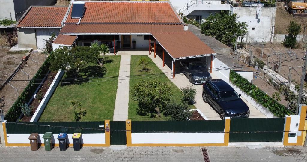 an aerial view of a house with a car parked in front at Villa Rosa in Corroios