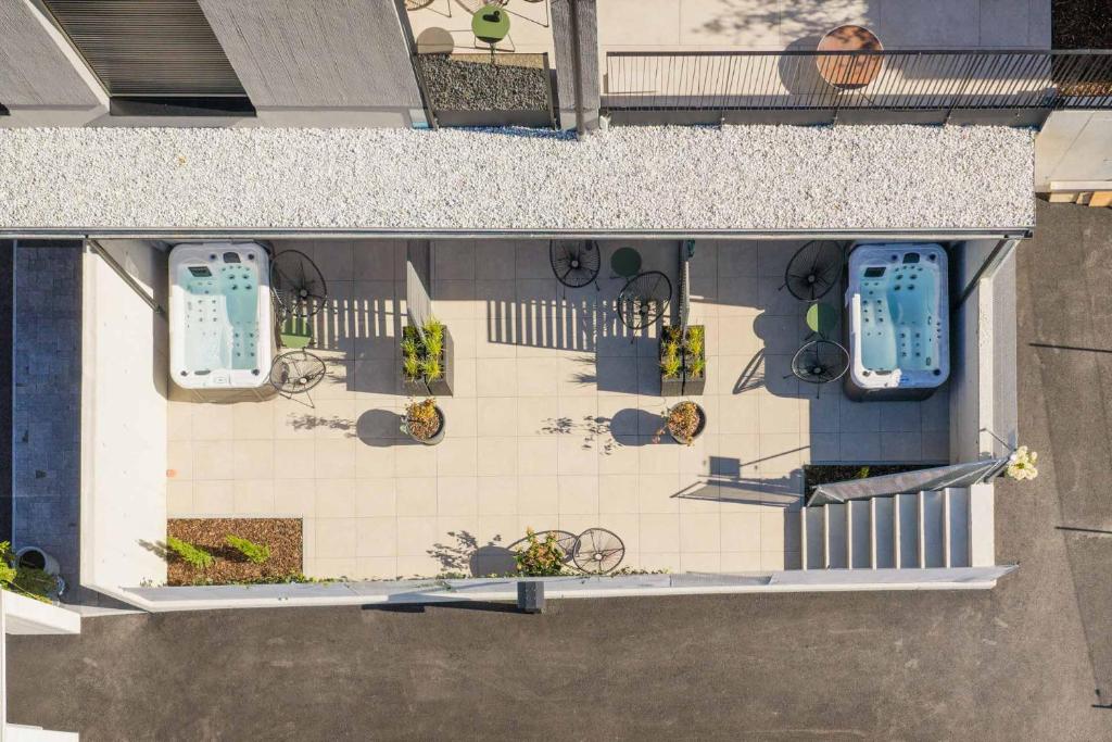 an overhead view of a patio with flowers and plants at WEIDE SUITES Stubaital - Adults Only in Schönberg im Stubaital