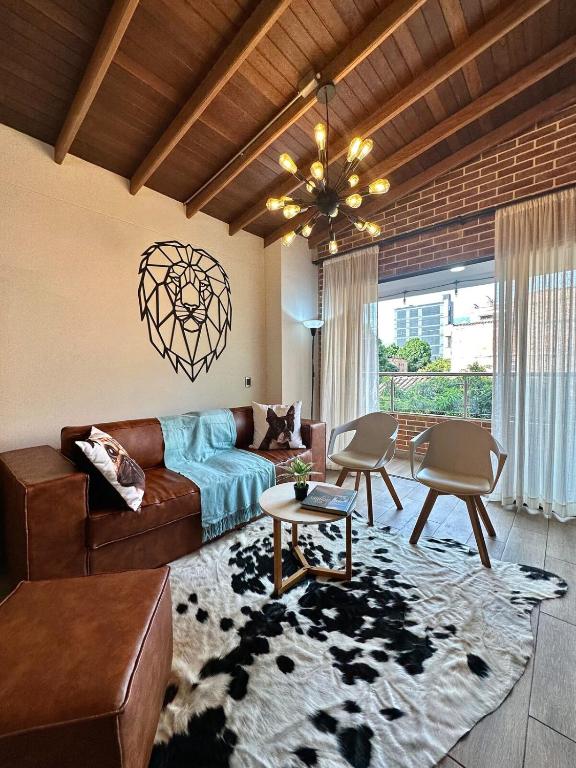 a living room with a couch and a table at Suitable unique design with natural light Envigado in Envigado