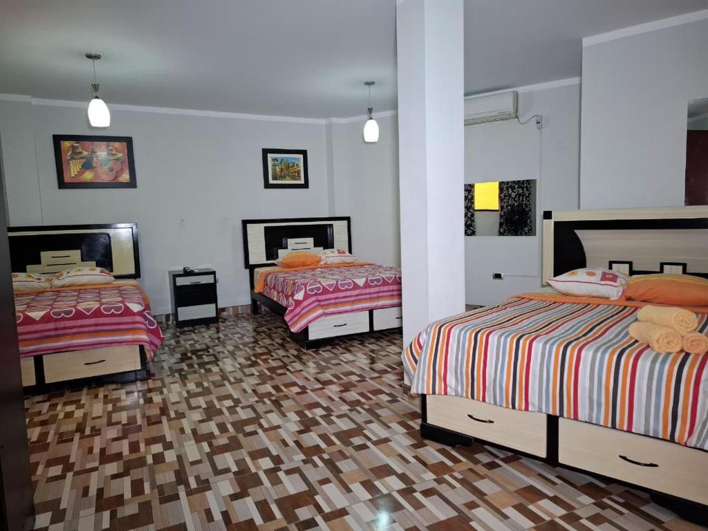 Ένα ή περισσότερα κρεβάτια σε δωμάτιο στο Hostal los Faroles