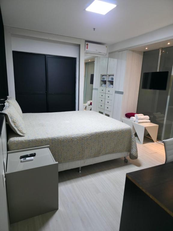 Postel nebo postele na pokoji v ubytování Flat Executive Arrey Hotel