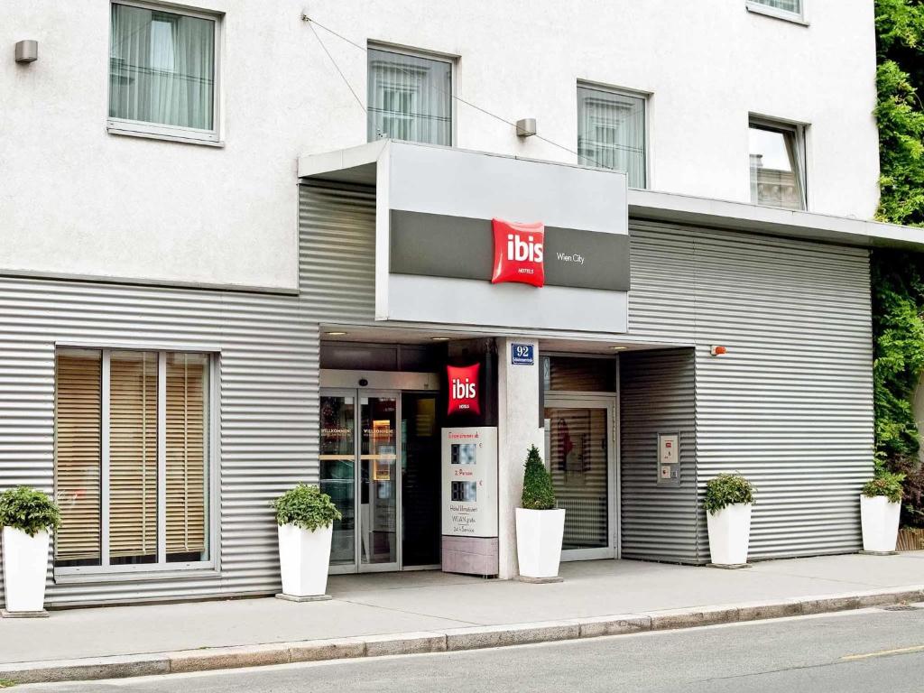 a building with a fedex sign on the side of it at ibis Wien City in Vienna