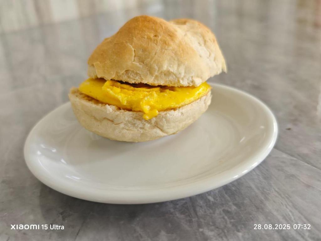 a egg sandwich on a plate on a table at Smith Inn & Restaurant in General Luna