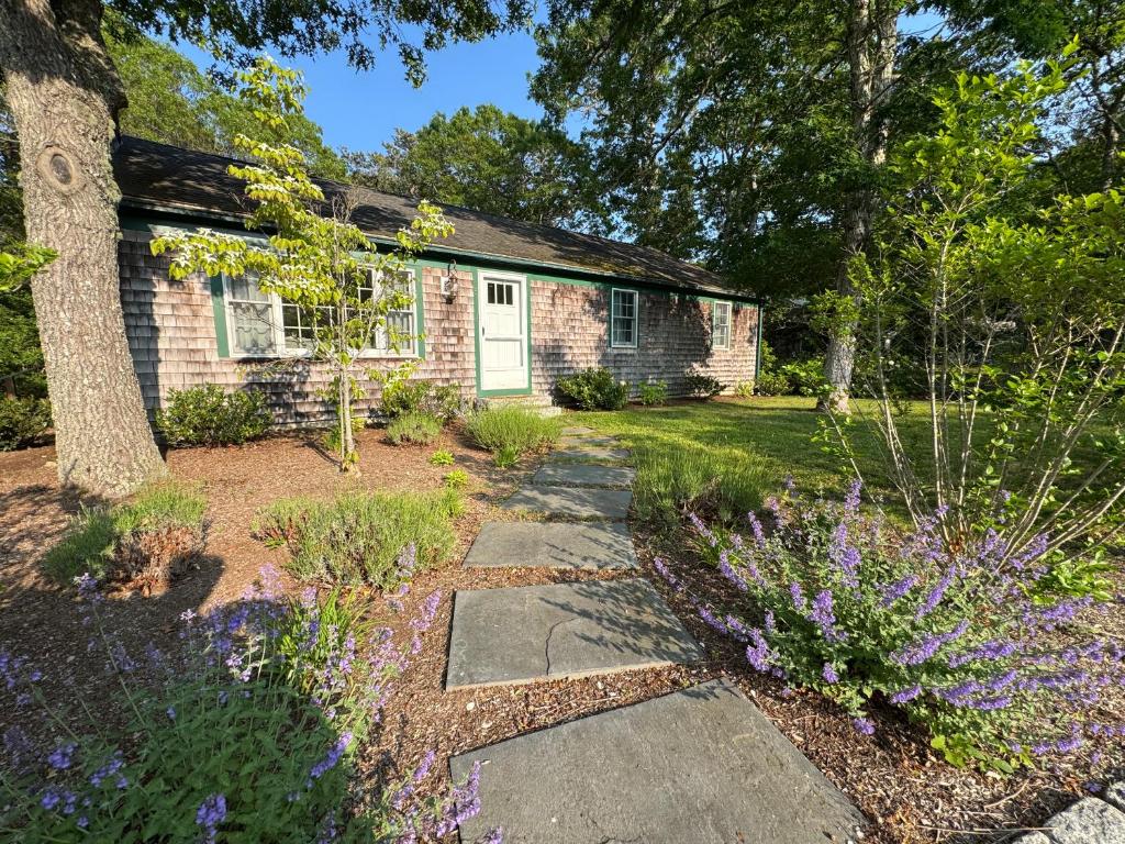 a stone walkway in front of a brick house at The Brewster Pearl in Brewster