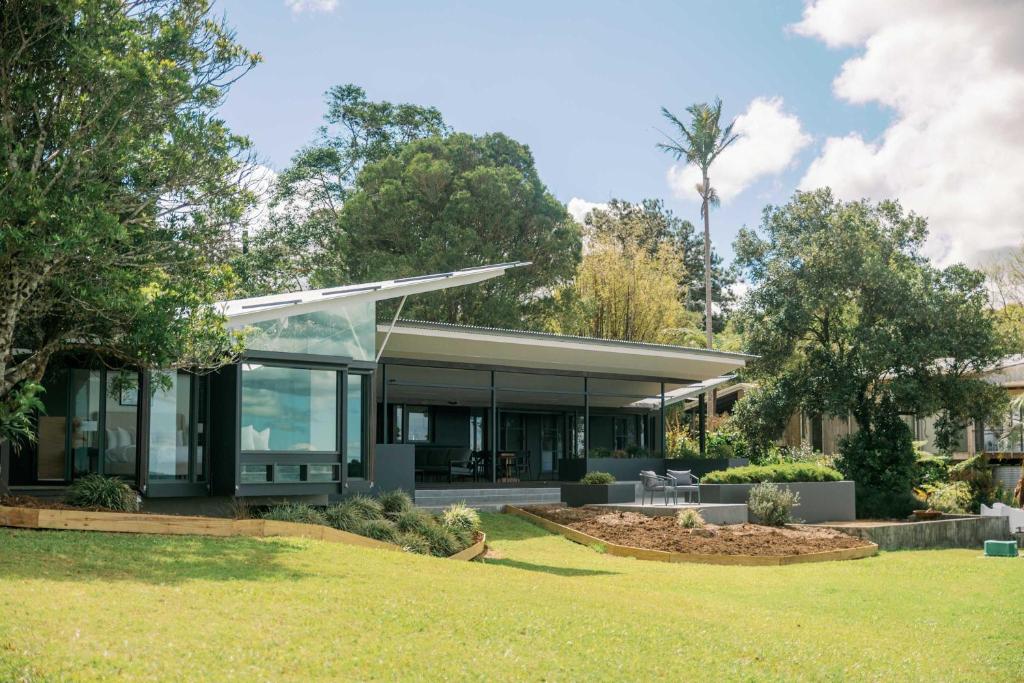 a house with a glass facade at Maleny Scenic Retreat in Booroobin