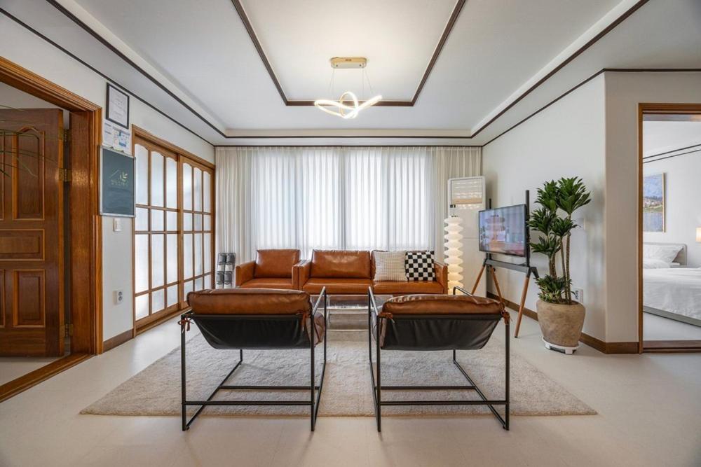 a living room with a couch and a table at Asan Wolang Stay in Asan