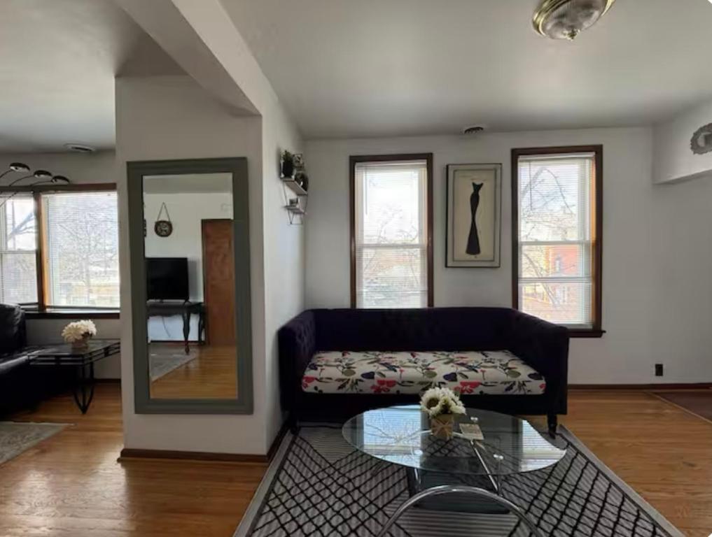 a living room with a couch and a glass table at Location! Location! 2bd 1bth spacious apartment! in Chicago