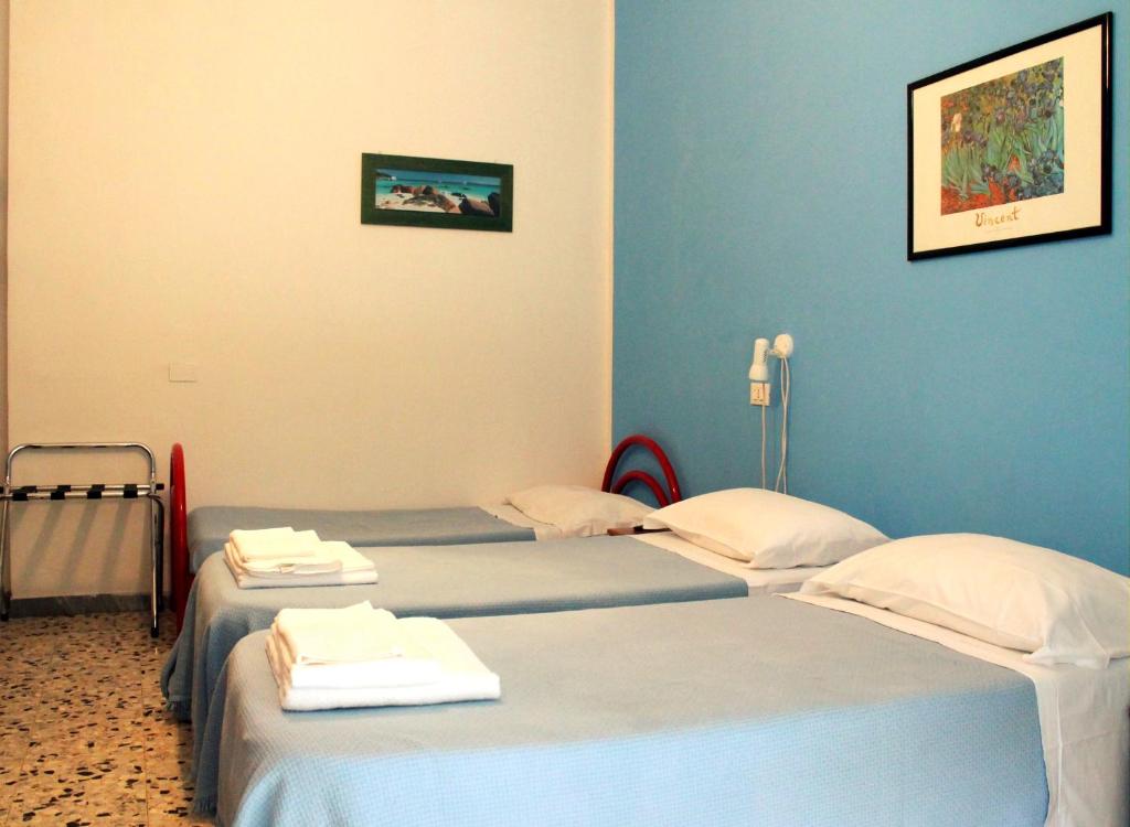 Postel nebo postele na pokoji v ubytování Albergo Nella