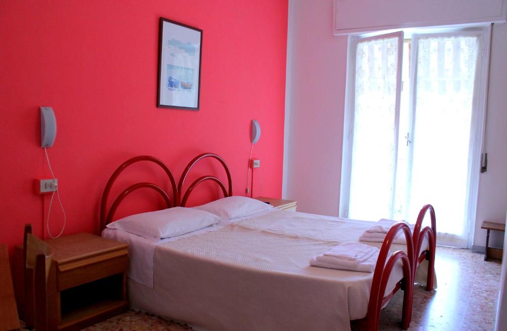 Postel nebo postele na pokoji v ubytování Albergo Nella