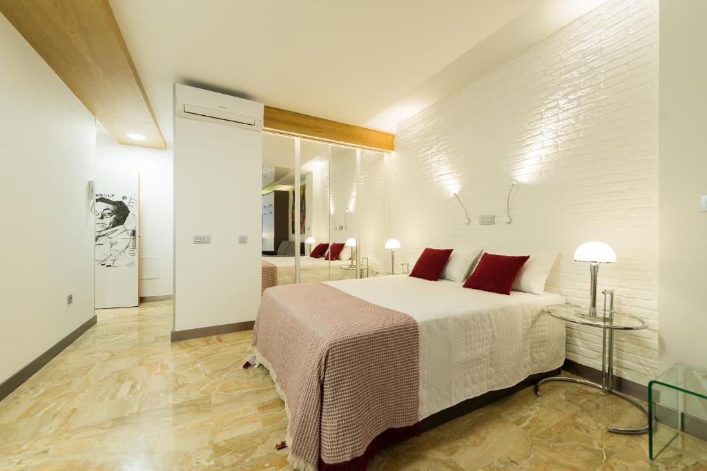 Posteľ alebo postele v izbe v ubytovaní Suites Garden Loft Kandinsky