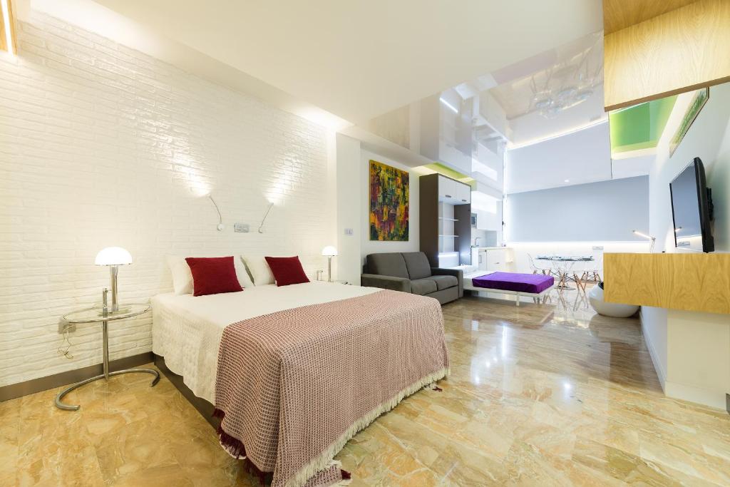 Televízia a/alebo spoločenská miestnosť v ubytovaní Suites Garden Loft Kandinsky