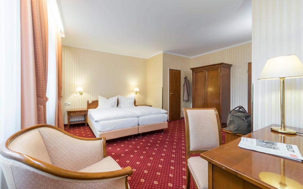 Postel nebo postele na pokoji v ubytování Trip Inn Stadthotel Coburg