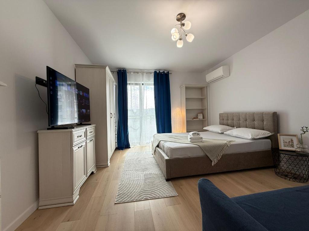 Ένα ή περισσότερα κρεβάτια σε δωμάτιο στο Apartment lângă Mitropolie si Palas cu parcare inclusa