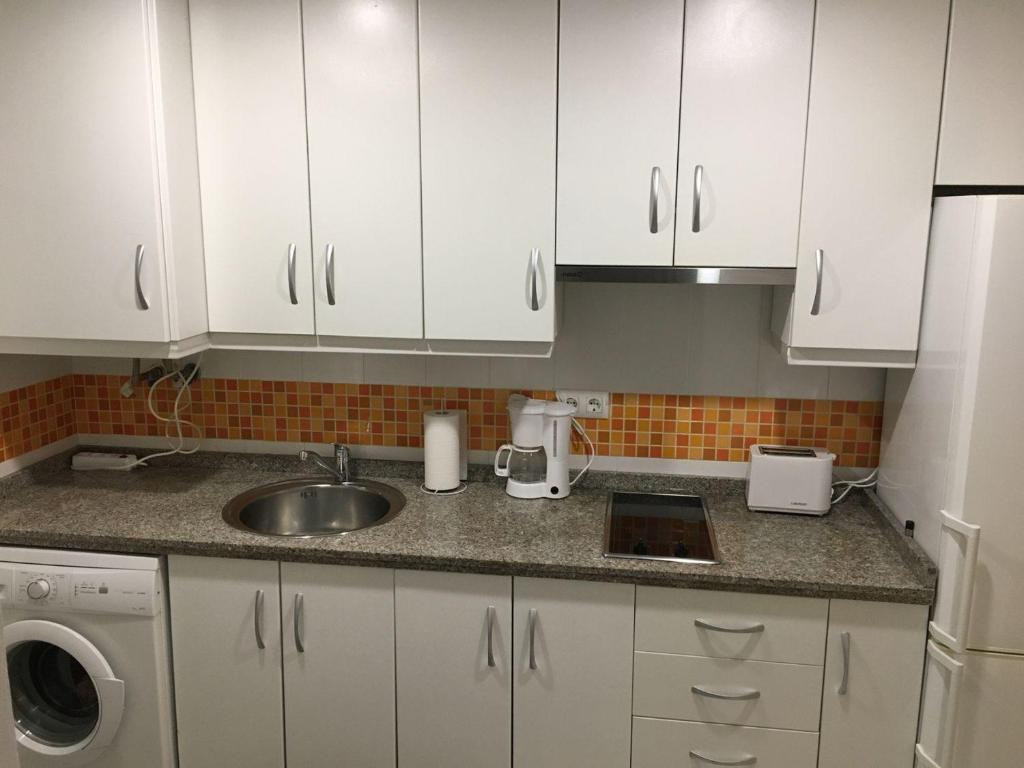Η κουζίνα ή μικρή κουζίνα στο Acino Apartamento