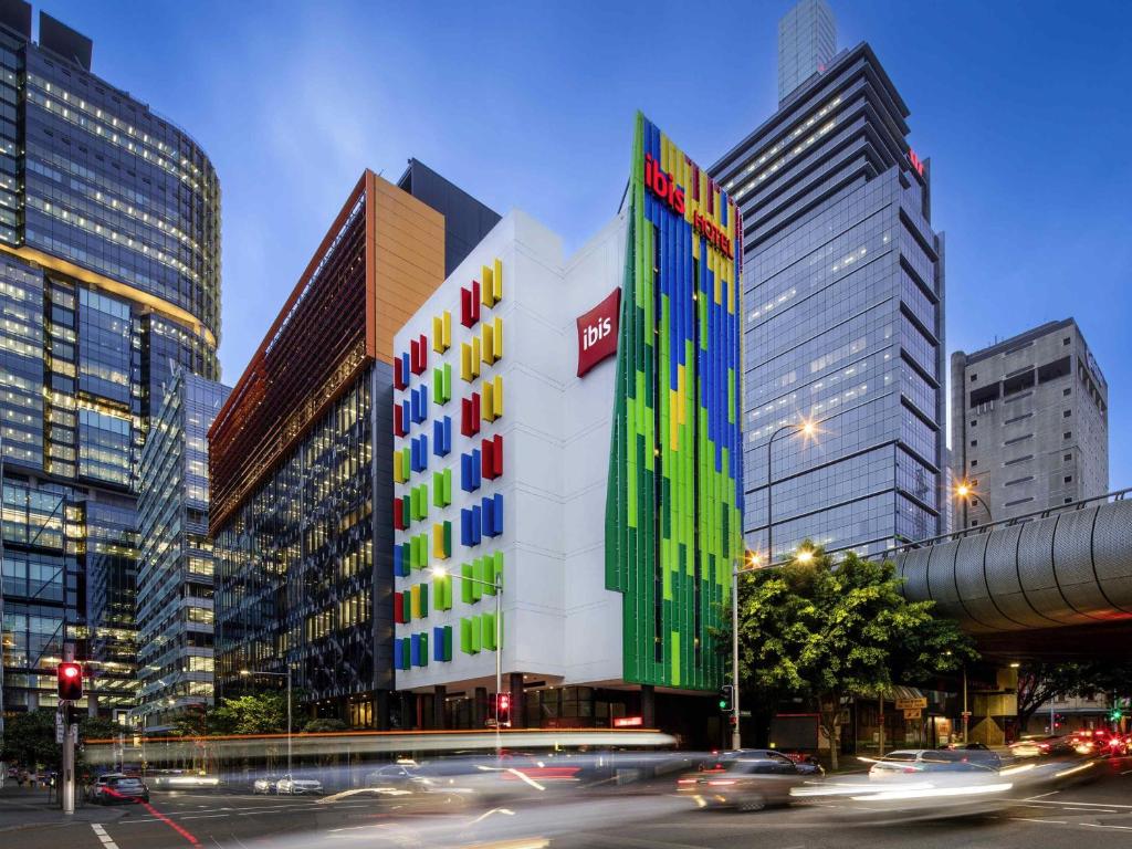 a building with colored squares on it in a city at ibis Sydney Barangaroo in Sydney