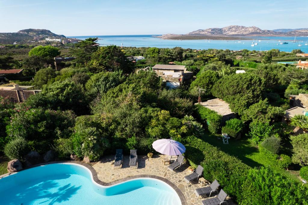 an aerial view of a resort with a swimming pool at Villa Flor, Exclusive House with Pool in Stintino in Stintino